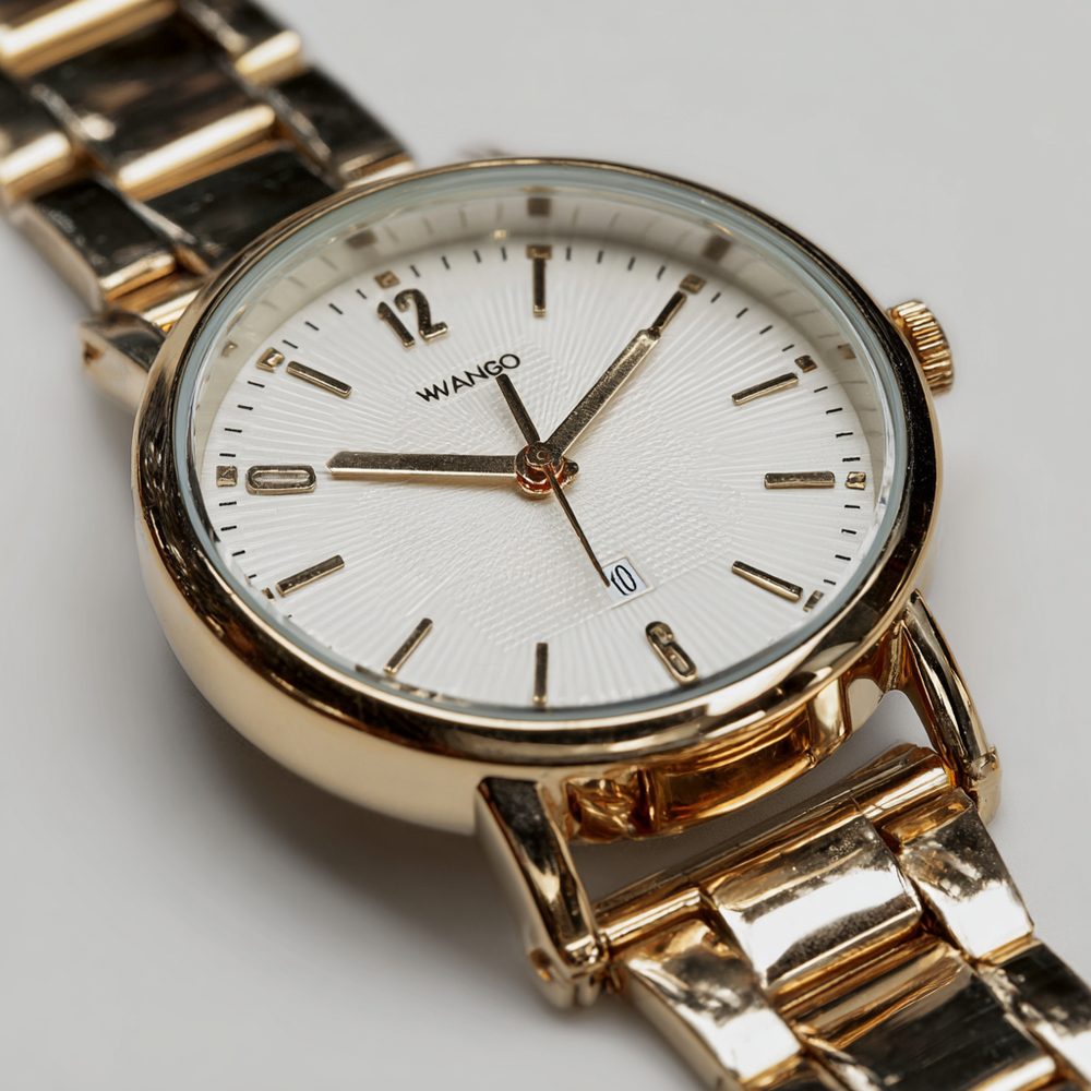 A generic gold-tone quartz wristwatch on a white background